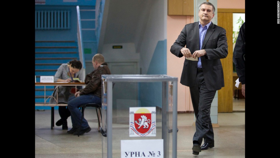 The newly installed pro-Russian leader of Crimea, Sergey Aksyonov, casts his ballot at a polling station. He called on the residents of Crimea to cast their votes &quot;independent of nationalism and disintegration.&quot;
