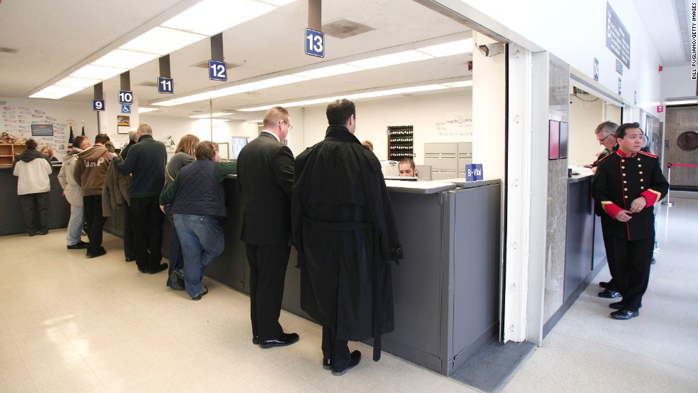 Same-sex couples get their marriage licenses at the Oakland County Courthouse in Pontiac, Michigan, on March 22, 2014, a day after a federal judge overturned Michigan&#39;s ban on same-sex marriage.