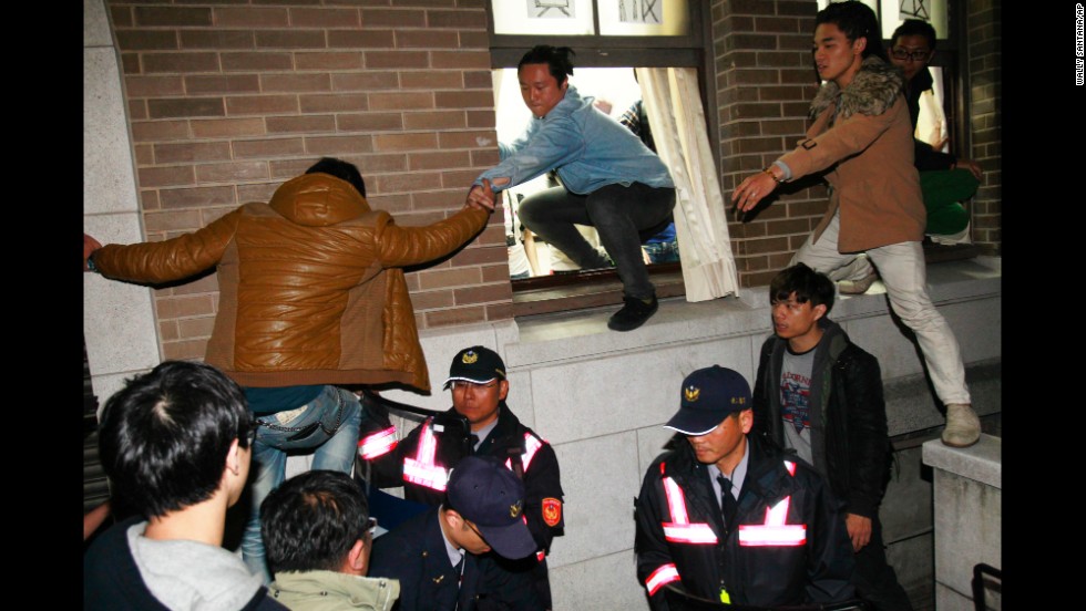 Protesters storm government buildings in Taipei on March 24.