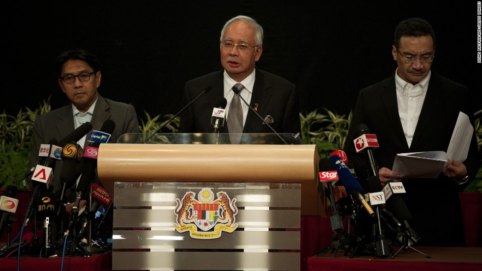 Malaysian Prime Minister Najib Razak, center, delivers a statement about the flight on March 24, 2014. Razak&#39;s announcement came after the airline sent a text message to relatives saying it &quot;deeply regrets that we have to assume beyond any reasonable doubt that MH 370 has been lost and that none of those onboard survived.&quot;