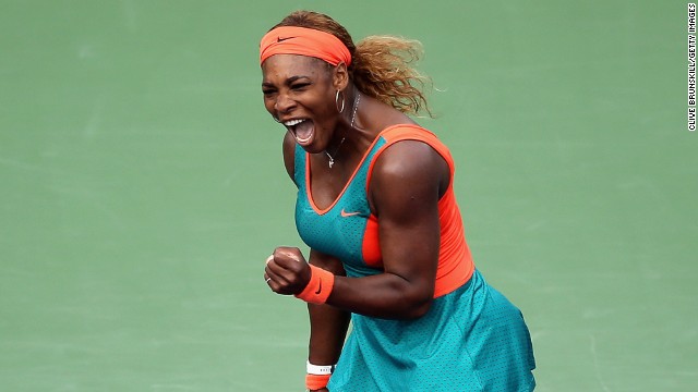 Serena Williams punches the air in delight during her semifinal match-up with Russia&#39;s Maria Sharapova.
