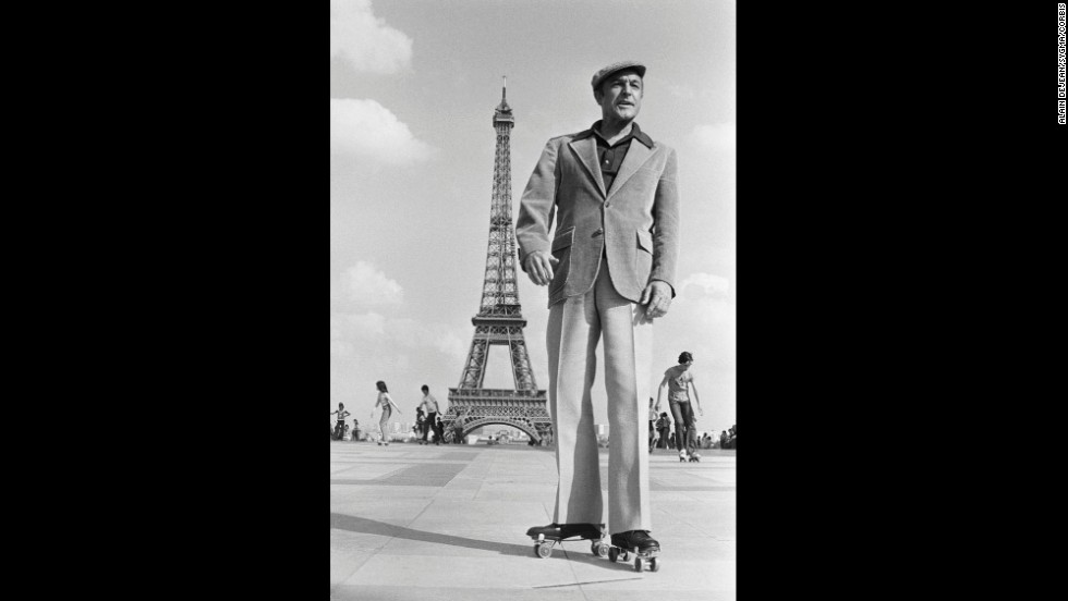 Gene Kelly wears roller skates in Paris while shooting scenes for &quot;That&#39;s Entertainment, Part II.&quot;