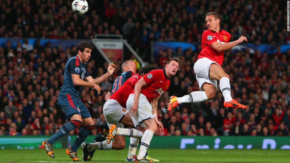 Nemanja Vidic of Manchester United heads in the first goal during the UEFA Champions League quarterfinal first leg between Manchester United and Bayern Munchen at Old Trafford.