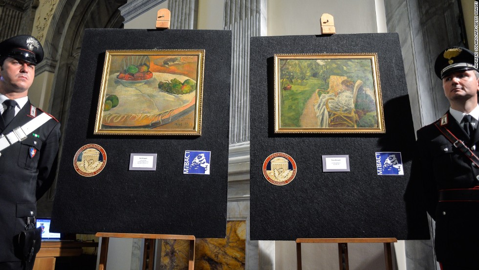 Italy&#39;s Culture Ministry unveils two paintings by the French artists Paul Gauguin and Pierre Bonnard on April 2, 2014. The paintings were stolen from a family house in London in 1970, abandoned on a train and then later sold at a lost-property auction, where a factory worker paid 45,000 Italian lira for them -- roughly equivalent to 22 euros ($30) at the time.