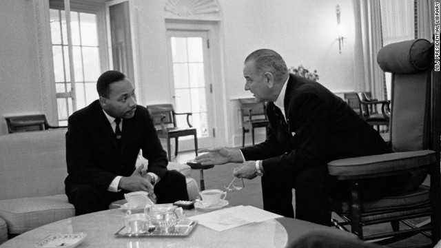 Martin Luther King, Jr., left, speaks with President Lyndon B. Johnson in the Oval Office on December 3, 1963. 