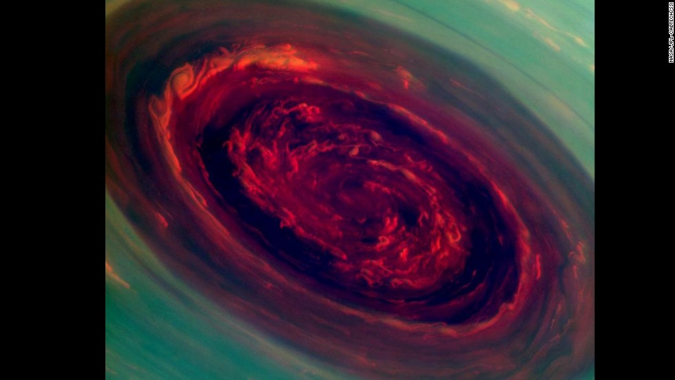 This false-color image of Saturn&#39;s north polar storm looks like a giant red rose surrounded by green foliage. Measurements indicate the storm&#39;s eye is a staggering 1,250 miles across with cloud swirling as fast as 330 mph.