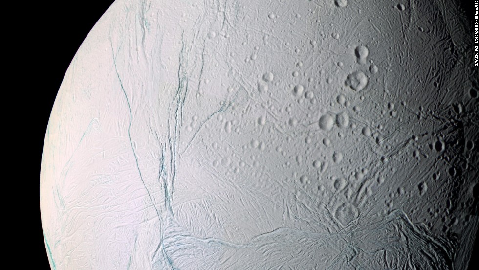 The scars of time and space mark the surface of Saturn&#39;s moon Enceladus. Saturn has at least 62 moons in its orbit. 