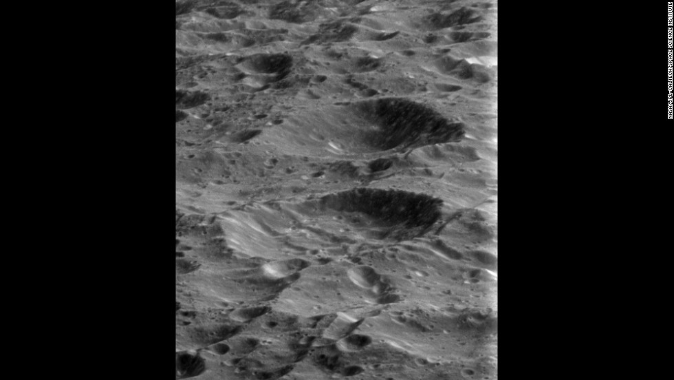 Rhea&#39;s surface is pockmarked with craters from billions of years of impacts. The moon is Saturn&#39;s second-largest, with a diameter of 949 miles.