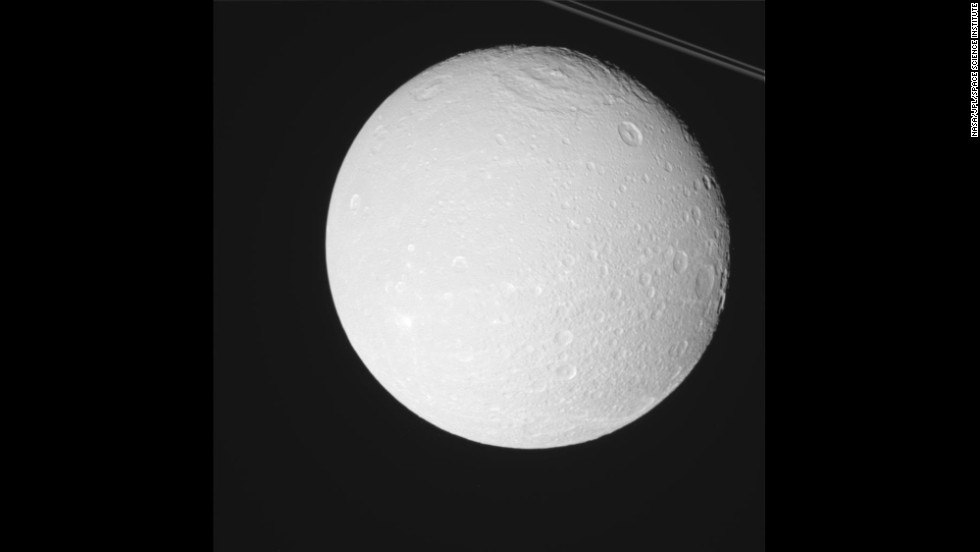 Saturn has a small moon called Dione orbiting about 234,000 miles away. That&#39;s about the same distance Earth is from its moon.