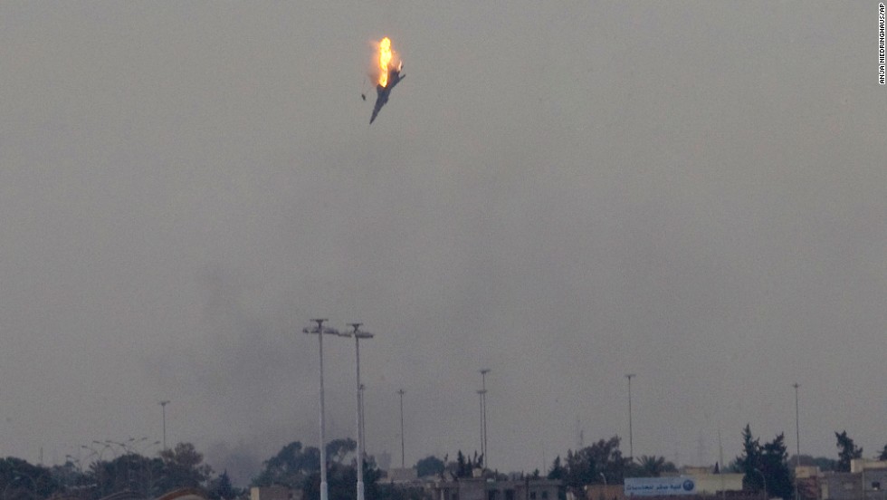 A warplane of Moammar Gadhafi&#39;s forces is shot down over the outskirts of Benghazi, Libya, in March 2011.
