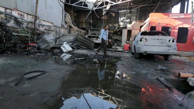 Palestinians inspect the rubble of a destroyed metal workshop after it was hit by an Israeli missile strike in Jabaliya refugee camp, in the northern Gaza Strip, Friday. The following night, Israeli warplanes struck five targets in Gaza.