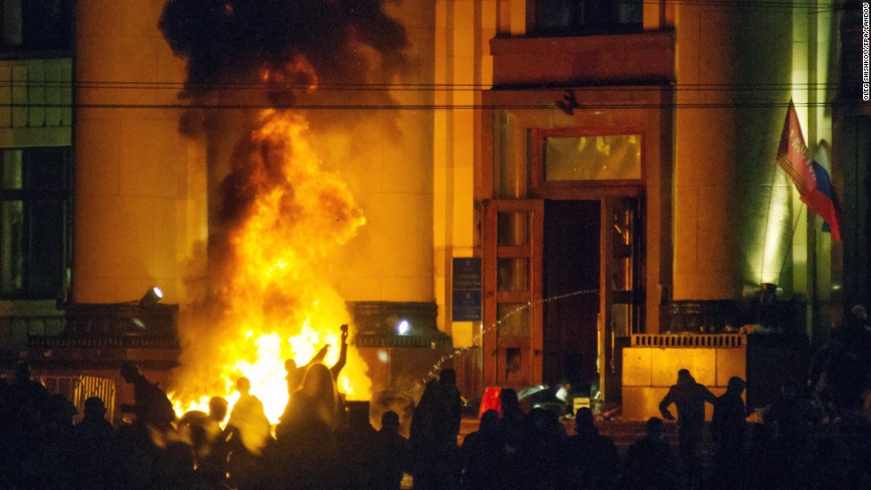 Pro-Russian protesters burn tires near a regional administration building in Kharkiv after police cleared the building on Monday, April 7.