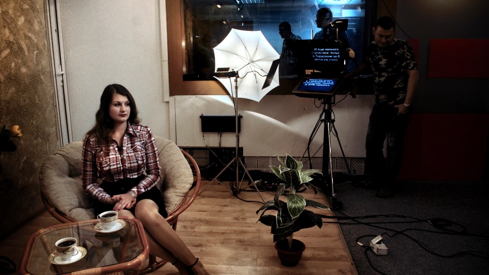 A woman films a scene from &quot;Tea in the Morning,&quot; a show on state television in Transnistria.