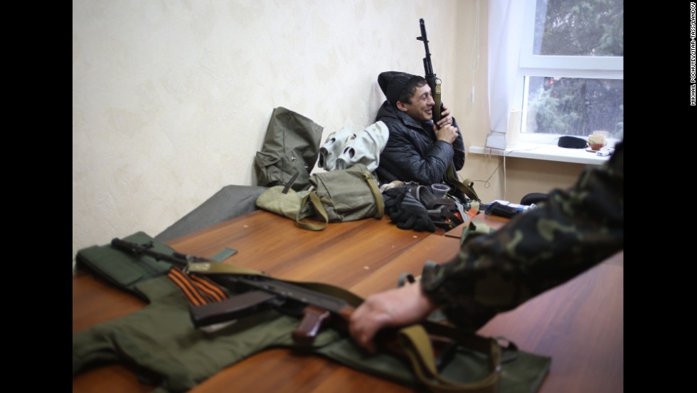 Armed pro-Russian protesters occupy the Security Service building in Luhansk on April 10.