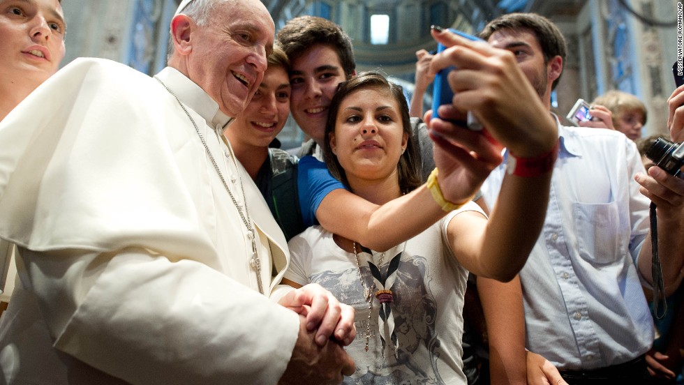Francis has his picture taken inside St. Peter&#39;s Basilica with youths who came to Rome for a pilgrimage in August 2013.