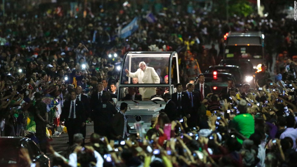 Crowds swarm the Pope as he makes his way through World Youth Day in Rio de Janeiro in July 2013. According to the Vatican, 1 million people turned out to see the Pope. 
