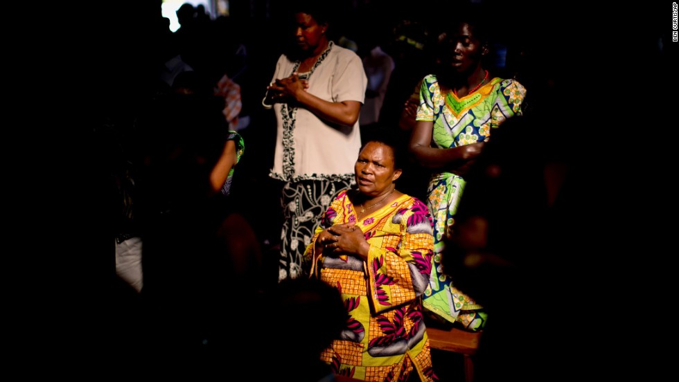 Members of the Sainte-Famille Catholic Church congregation pray during a Sunday morning service in Kigali on April 6. The church was the scene of many killings during the 1994 genocide.