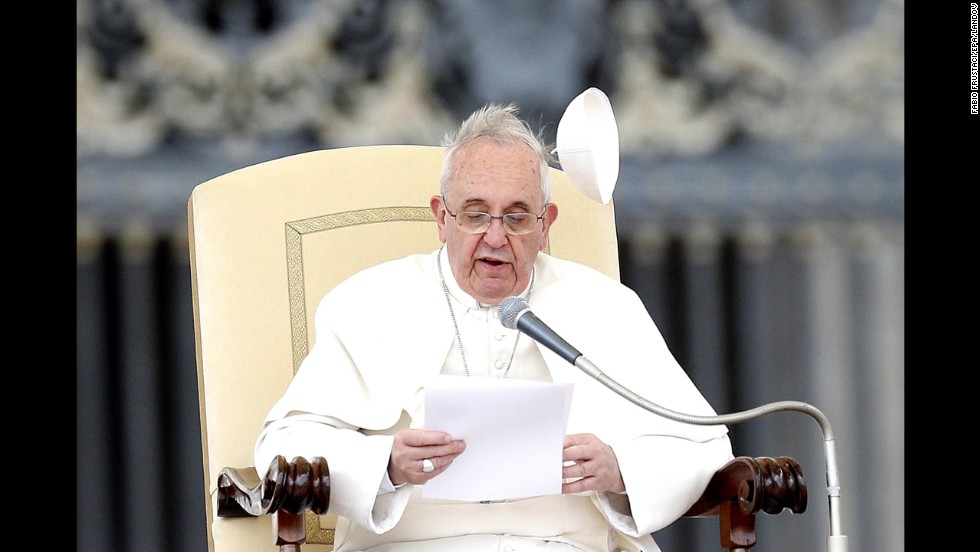 Wind blows the papal skullcap off Pope Francis&#39; head in February 2014.