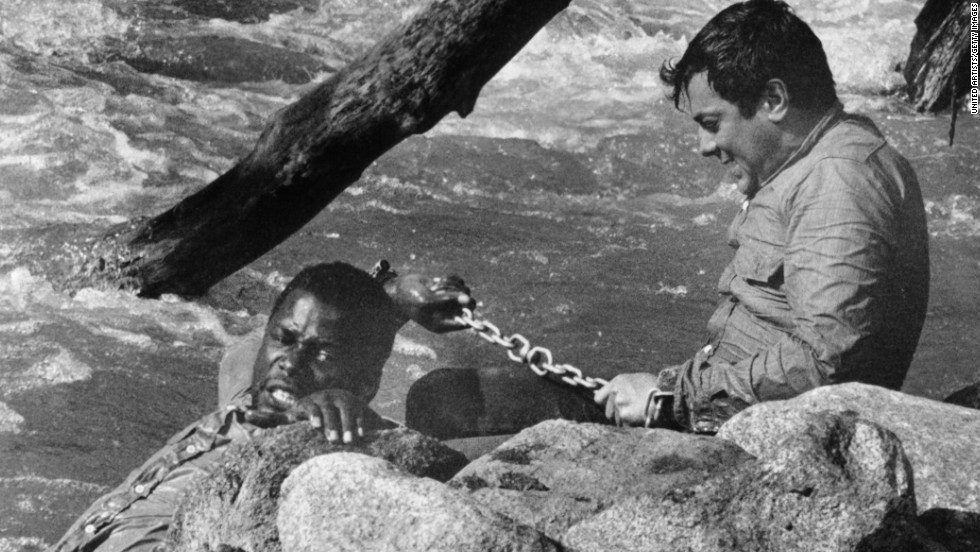 Poitier was paired with Hollywood A-lister Tony Curtis in 1958&#39;s &quot;The Defiant Ones.&quot; It&#39;s a story of two escaped prisoners, a black man and a white man, who are chained together and have to learn to respect and work with each other. Poitier was nominated for an Oscar, becoming the first black man to earn a best actor nod. The film was directed by Stanley Kramer, who was known for his message movies.