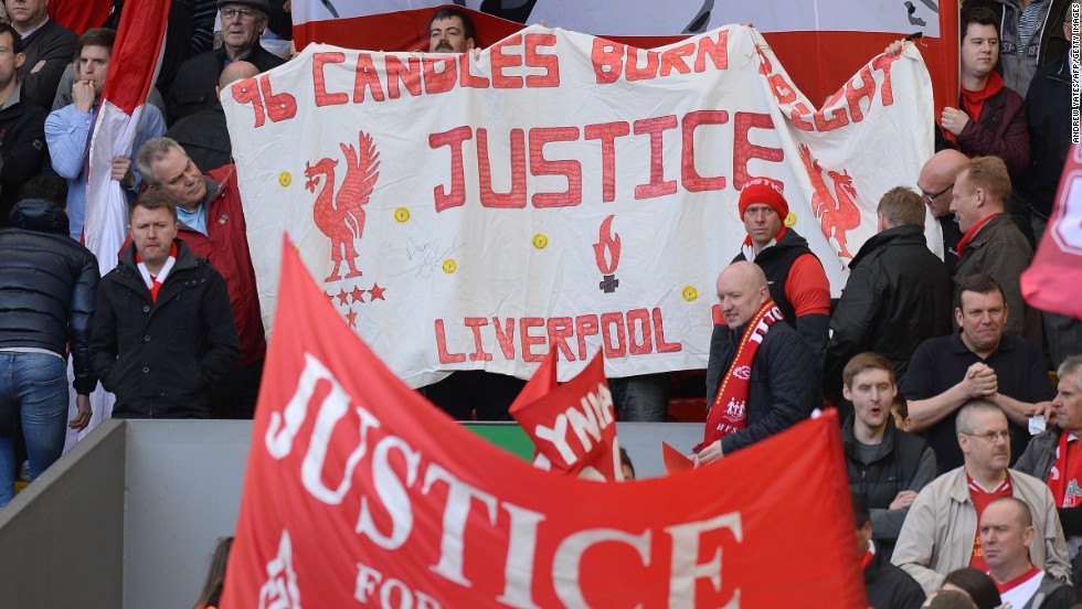 Fans in the Kop stand at Anfield display banners in memory of the Hillsborough victims. 