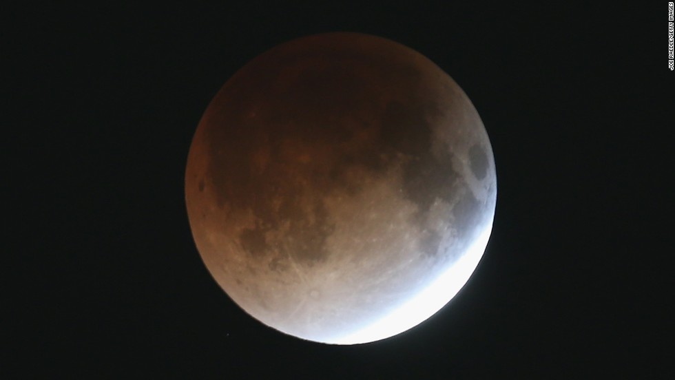 The moon begins to take on a reddish hue early Tuesday from Miami. The moon did so as it appeared in different phases between 2 and 4:30 a.m. ET.