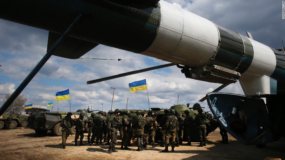 Ukrainian troops receive munitions at a field on the outskirts of Izium on April 15.