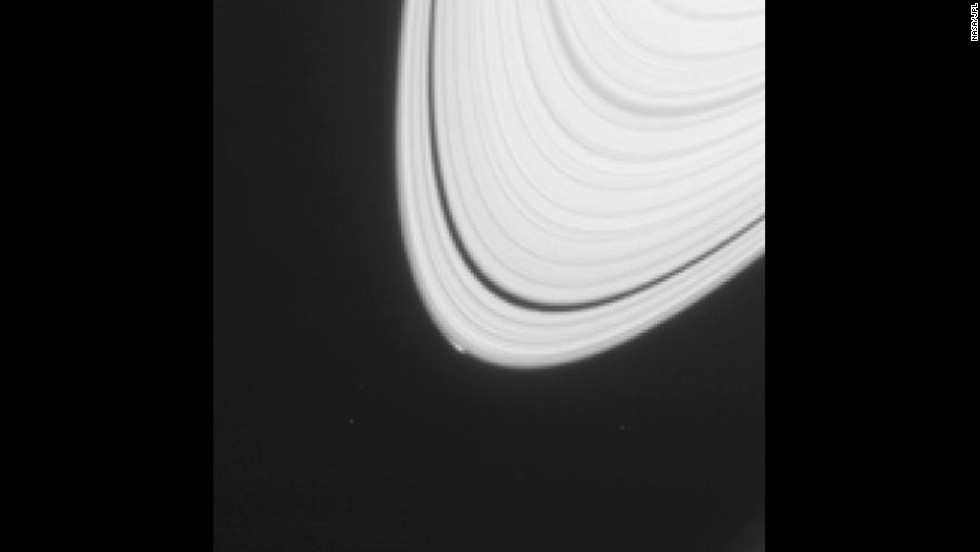 A small, bright blip can be seen on the outermost edge of Saturn&#39;s rings in this image taken in April 2013. The bump in the smooth ring structure is an icy object that could provide clues to how Saturn&#39;s moons formed.