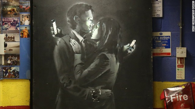 New Banksy artwork, Mobile Lovers, displayed inside the Broad Plain Boys youth center on April 16, 2014 in Bristol, England. 