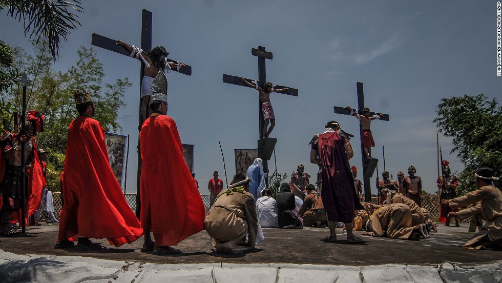 Penitents in San Fernando, Philippines, hang from wooden crosses on Good Friday as they take part in a re-enactment of Jesus Christ&#39;s crucifixion. 