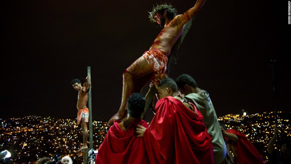 Residents re-enact Jesus Christ&#39;s crucifixion on a hilltop in the Petare shanty town during Holy Week in Caracas, Venezuela, on Friday, April 18.