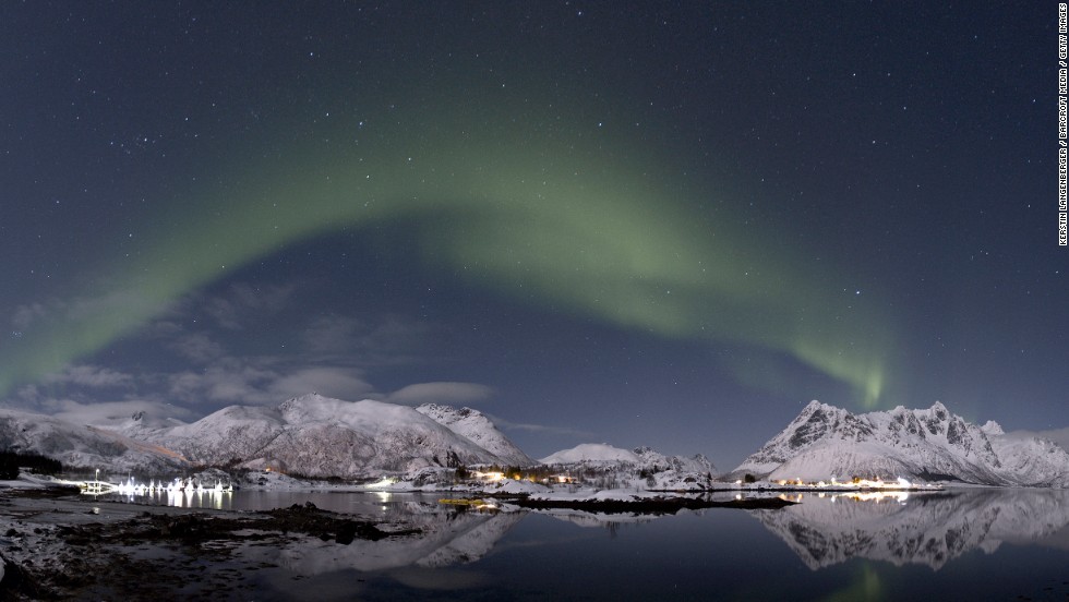 The aurora borealis lights up the night sky in Lofoten, Norway. The spectacular shows occur when charged particles from the solar wind interact with the Earth&#39;s atmosphere at the magnetic poles. 