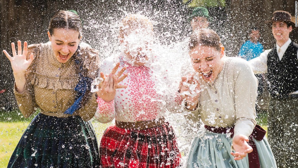 Women in traditional costumes are sprayed with water by men as members of the Marghareta Dance Group perform Easter folk traditions of the region in the Museum Village in Nyiregyhaza, northeast of Budapest, Hungary, on Monday, April 21. Click through the gallery to see how Christians around the world are observing Holy Week, which marks the last week of Lent and the beginning of Easter celebrations.