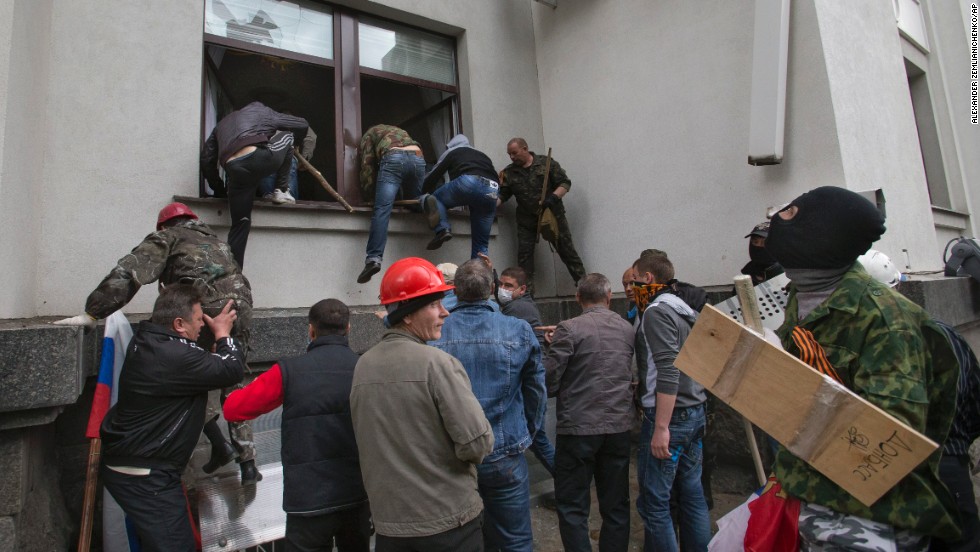 Pro-Russian activists storm an administration building in the center of Luhansk on Tuesday, April 29. 