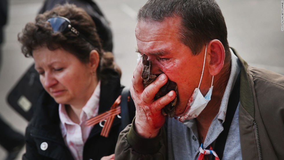 A pro-Russian activist is wounded after storming the prosecutor&#39;s office in Donetsk and clashing with riot police on May 1. 