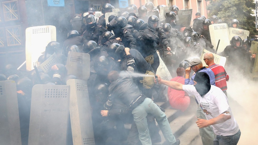 Pro-Russian activists storm the prosecutor&#39;s office in Donetsk on May 1. Police fired tear gas and stun grenades in an effort to disperse the activists.