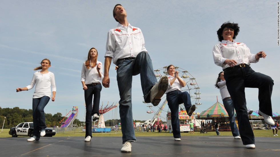 &quot;Rocky Top&quot; has become ingrained among thousands of Tennesseans, from the Smoky Mountains in the east to the western bluffs along the Mississippi River. Kelly Lovelace, 24, center, kicks it to the tune of &quot;Rocky Top&quot; with the Riverboat Cloggers during the 2012 Bartlett Festival and Car Show. 
