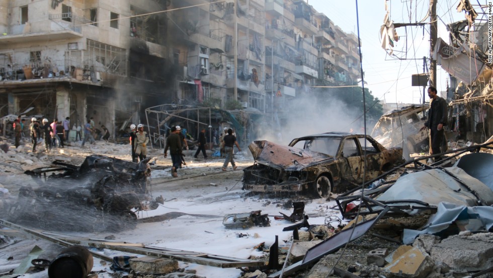 Syrians gather at the site of reported airstrikes in Aleppo on May 1. According to the Syrian Observatory for Human Rights, at least 33 civilians were killed in the attack.