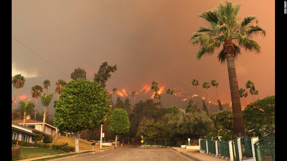 The report breaks the country down by region and identifies specific threats should climate change continue. Major concerns cited by scientists involved in creating the report include rising sea levels along America&#39;s coasts, drought in the Southwest and prolonged fire seasons. In this image from January 16, a wildfire burns in the hills just north of the San Gabriel Valley community of Glendora, California.