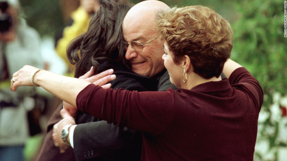 Lewinsky&#39;s father, Bernard, hugs her in front of his home in Brentwood, California, in 1998.