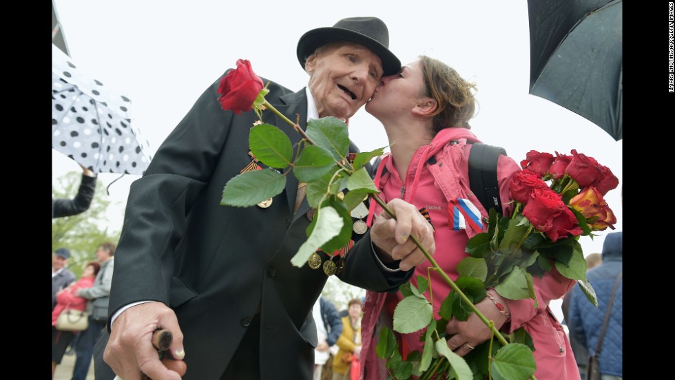 A woman kisses a World War II veteran in Riga, Latvia, on Friday, May 9, as the country&#39;s large Russian minority gathered to celebrate Victory Day, the anniversary of Nazi Germany&#39;s surrender to the Soviet Union.