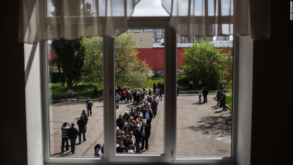 Ukrainians line up to cast their votes at a polling station in Donetsk on May 11.