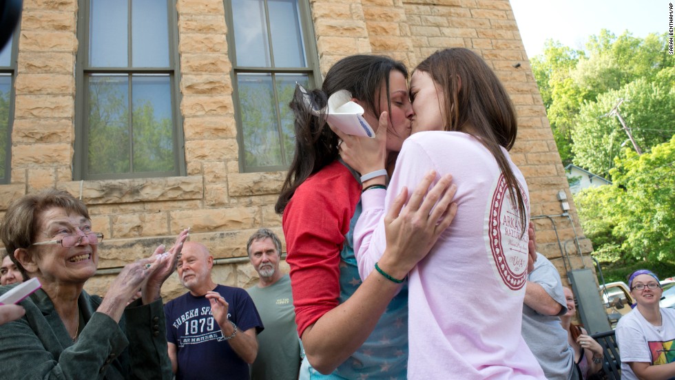 Jennifer Rambo, right, kisses her Kristin Seaton after their marriage ceremony in front of the Carroll County Courthouse in Eureka Springs, Arkansas, on May 10, 2014. Rambo and Seaton were the first same-sex couple to be granted a marriage license in Eureka Springs after a judge overturned Amendment 83, which banned same-sex marriage in Arkansas. 