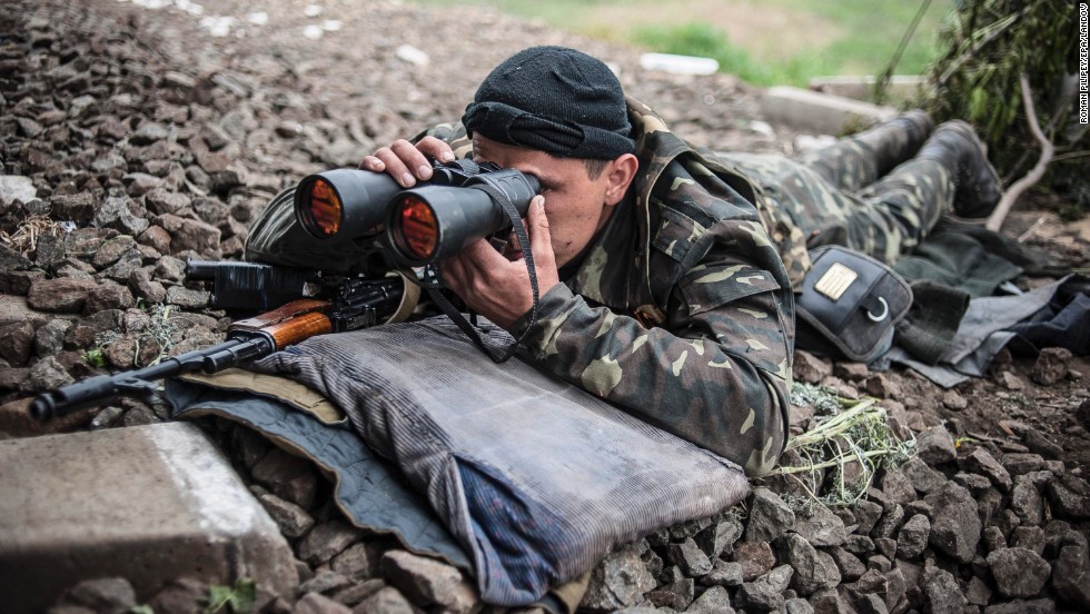 An armed pro-Russian separatist takes up a position near Slovyansk on May 12.
