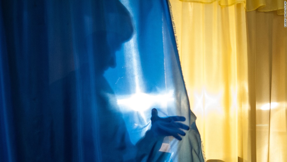 A person leaves a voting booth in Luhansk, Ukraine, on May 11. The Donetsk and Luhansk regions of eastern Ukraine voted on controversial referendums to declare independence from the government in Kiev. Acting Ukrainian President Oleksandr Turchynov called the vote &quot;propagandist farce.&quot;