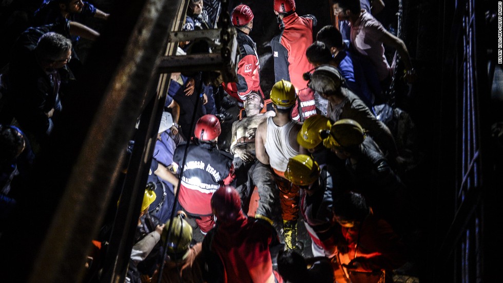 An injured miner is carried out by rescue workers. The mine shaft is about two-thirds of a mile -- or 1 kilometer -- underground, a disaster agency said.