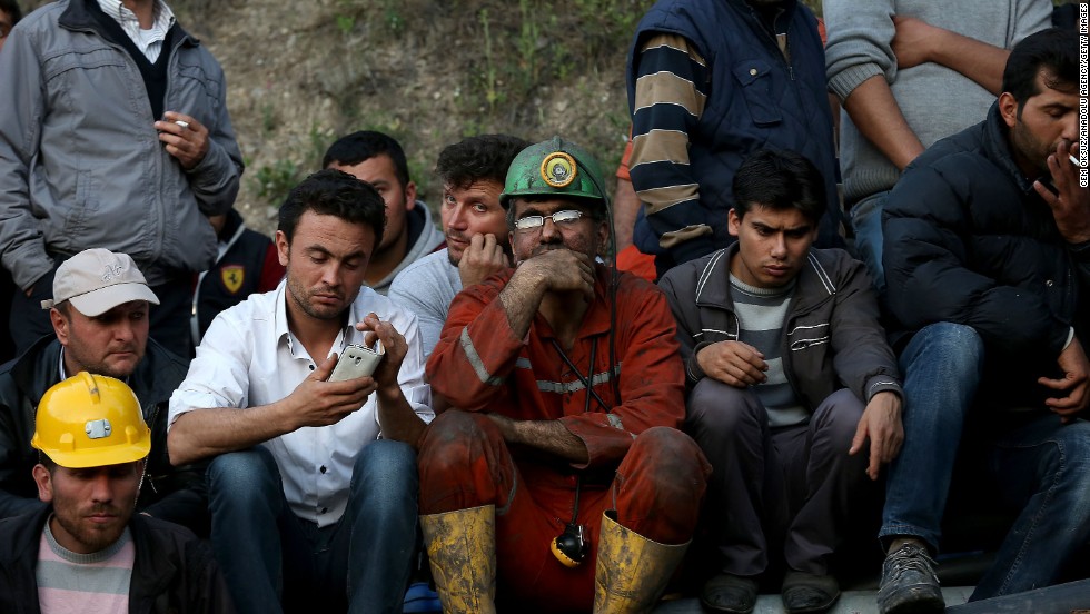 Miners and relatives wait outside the mine on May 13. Turkish Energy Minister Taner Yildiz said officials turned an exit pipe &quot;into a clean air pipe,&quot; so &quot;there is fresh air being given in places where there is no fire.&quot;