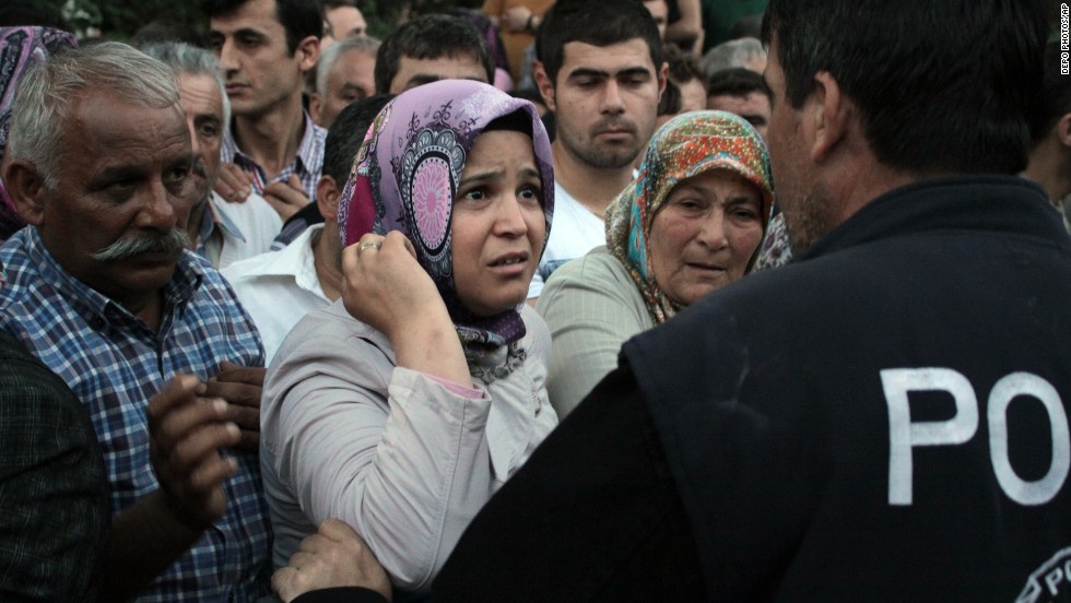 Relatives try to get information outside a Soma hospital on Tuesday, May 13.