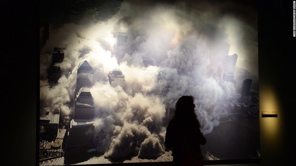 A photograph at the memorial shows one of the World Trade Center towers collapsing after the attack.