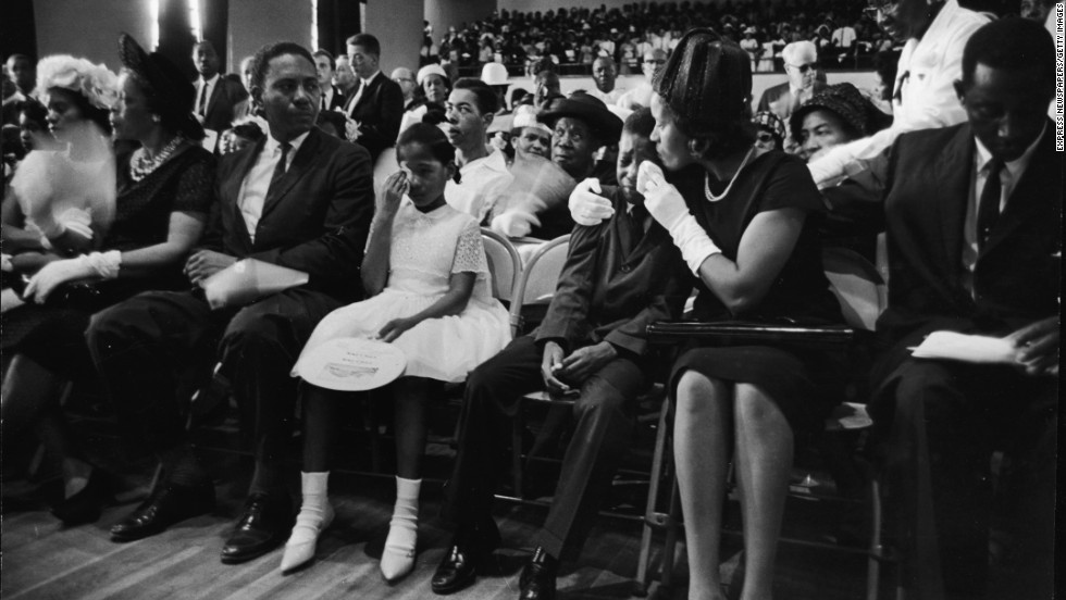 Myrlie Evers, widow of civil rights activist Medgar Evers, comforts their son Darrell while their daughter, Reena, wipes her tears during Evers&#39; funeral on June 18, 1963. Evers was assassinated days earlier at his home in Jackson, Mississippi.
