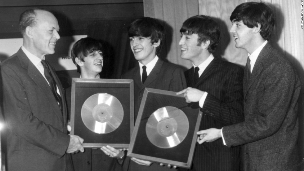The Beatles released their first album, &quot;Please Please Me,&quot; in the United Kingdom on March 22, 1963. Here, the band is honored on November 18, 1963, for the massive sales of albums &quot;Please Please Me&quot; and &quot;With the Beatles.&quot;